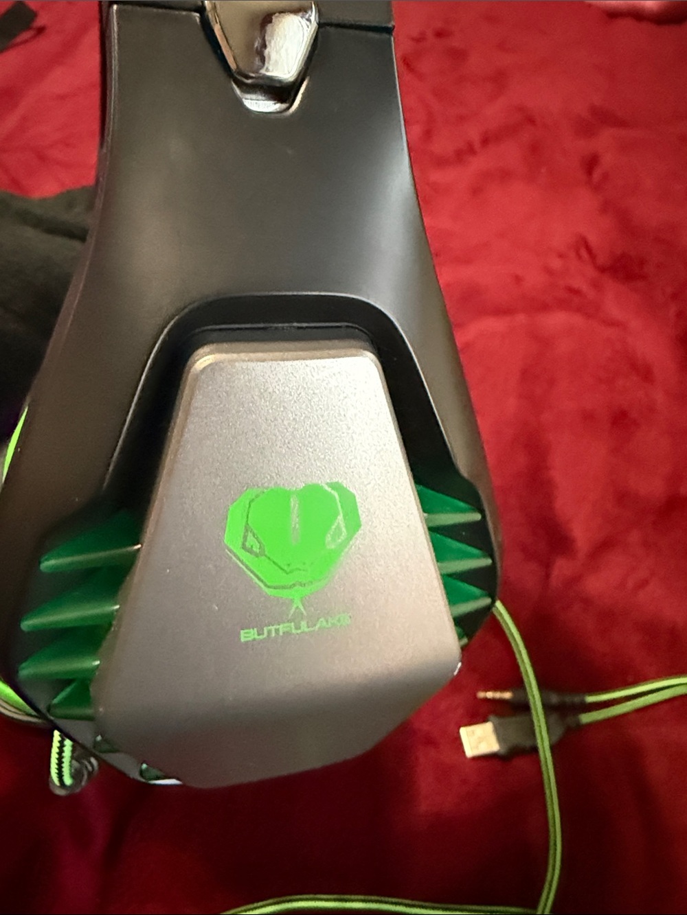 black and green Butfulake GH-1 Gaming Headset featuring glowing green LED accen